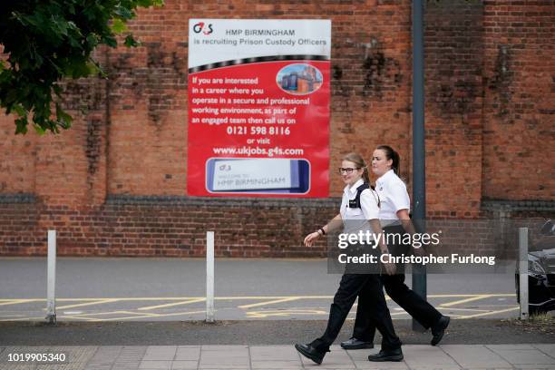 Prison officers walk past Birmingham Prison in Winson Green on August 20, 2018 in Birmingham, England. Birmingham Prison, formerly Winson Green...