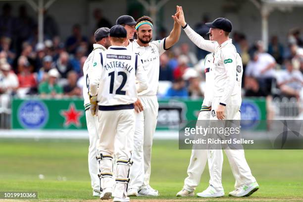 Yorkshire's Jack Brooks is congratulated after taking the wicket of Worcestershire's Tom Fell during day two of the Specsavers Championship Division...