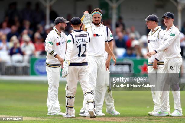 Yorkshire's Jack Brooks is congratulated after taking the wicket of Worcestershire's Tom Fell during day two of the Specsavers Championship Division...