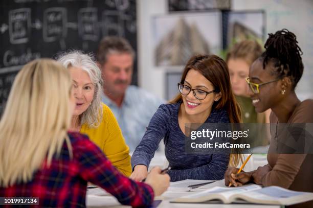 studying together - adult learning stock pictures, royalty-free photos & images