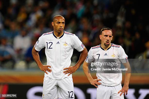 Thierry Henry and Franck Ribery of France look dejected during the 2010 FIFA World Cup South Africa Group A match between Uruguay and France at Green...