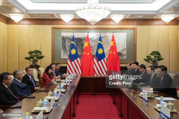 Malaysian Prime Minister Mahathir Mohamad and Chinese President Xi Jinping during their meeting at Diaoyutai State Guesthouse on August 20 2018 in...