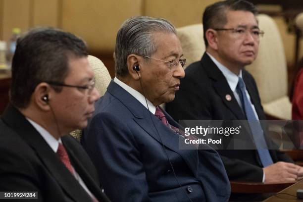 Malaysian Prime Minister Mahathir Mohamad speaks to Chinese President Xi Jinping during their meeting at Diaoyutai State Guesthouse on August 20 2018...