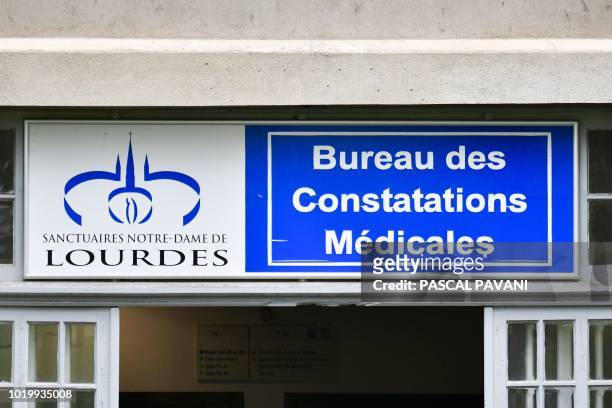 Picture taken on August 13 in Lourdes at the Sanctuary of Our Lady of Lourdes, shows the entrance of the Lourdes Medical Bureau which examines and...