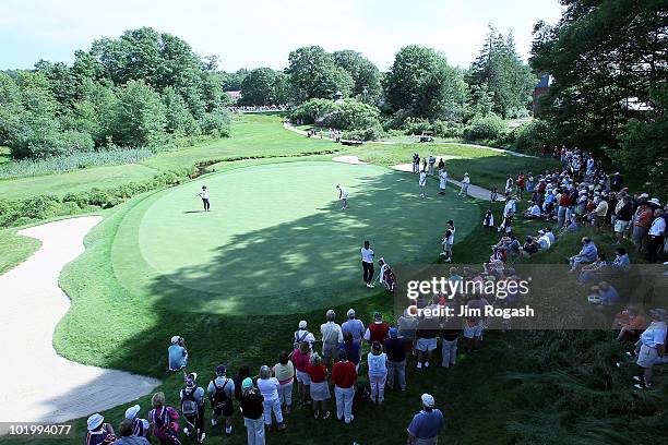Participants putt on the seventh green in Four-Balls competition during the 2010 Curtis Cup Match at the Essex Country Club on June 11, 2010 in...