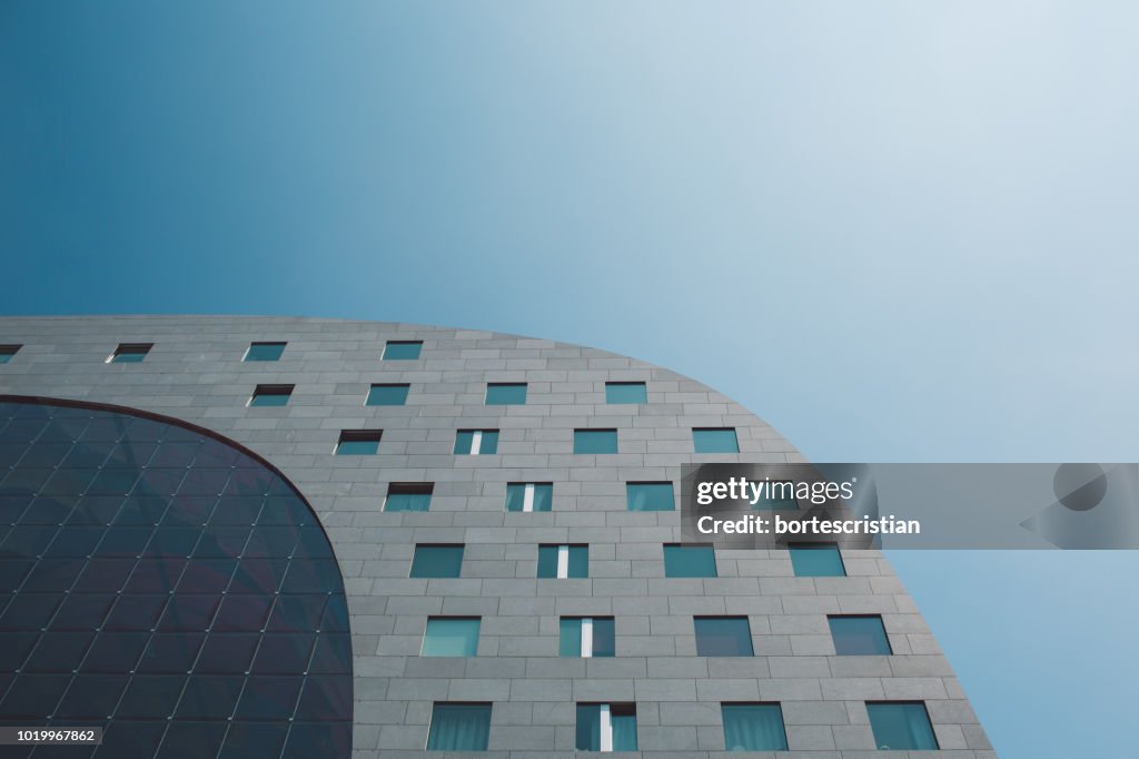 Low Angle View Of Modern Building Against Clear Sky