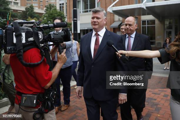 Kevin Downing, lead lawyer for former Donald Trump Campaign Manager Paul Manafort, center, speaks to members of the media while arriving to District...