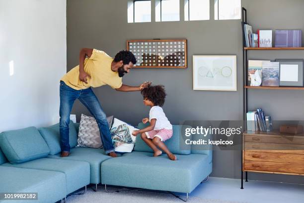 be careful not to fall off the couch my son - new sofa stock pictures, royalty-free photos & images