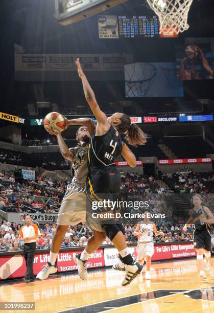 Roneeka Hodges of the San Antonio Silver Stars shoots against Amber Holt of the Tulsa Shock on June 11, 2010 at the AT&T Center in San Antonio,...