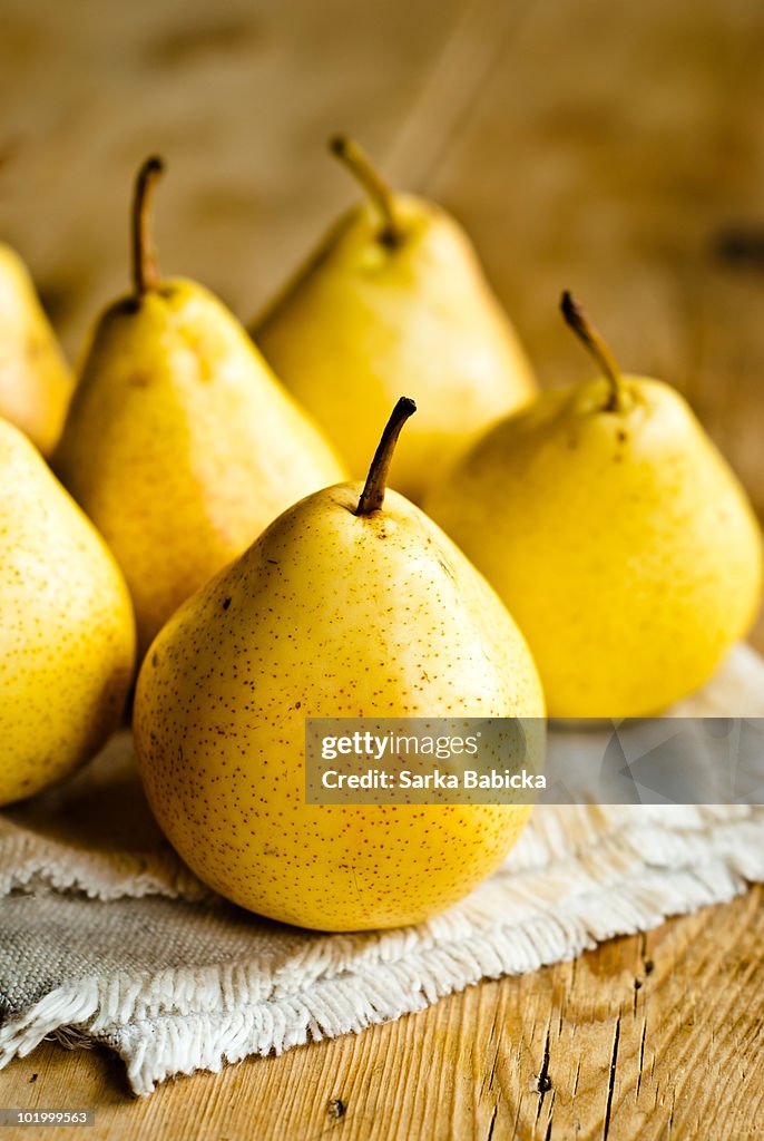 Yellow pears on a table