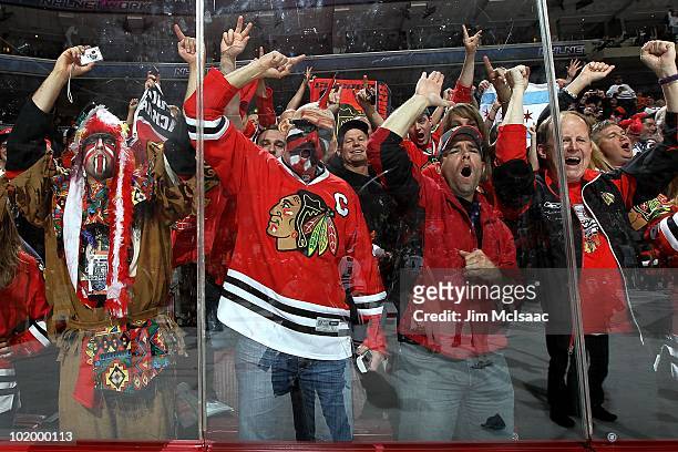 Fans of the Chicago Blackhawks celebrate after the Blackhawks defeated the Philadelphia Flyers 4-3 in overtime to win the Stanley Cup in Game Six of...