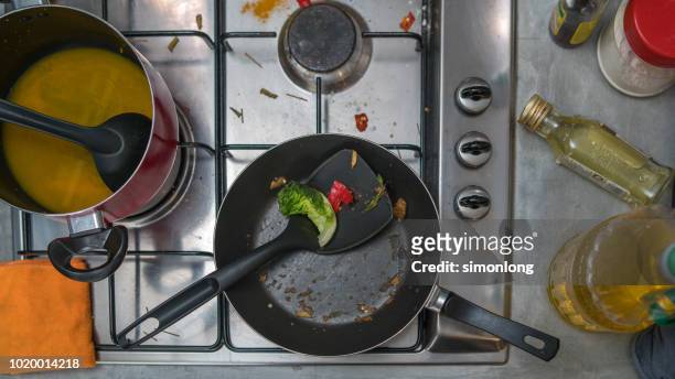 dirty dishes in kitchen - stove top stock-fotos und bilder