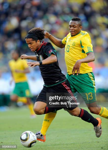 Giovani Dos Santos of Mexico chased by Kagisho Dikgacoi of South Africa during the 2010 FIFA World Cup South Africa Group A match between South...