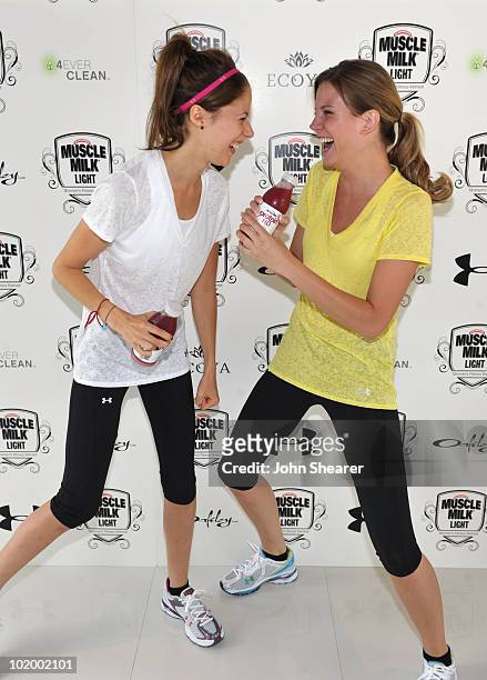 Actresses Amanda Crew and Amber Borycki attend the "Muscle Milk Light" Women's Fitness Retreat on June 11, 2010 in Beverly Hills, California.
