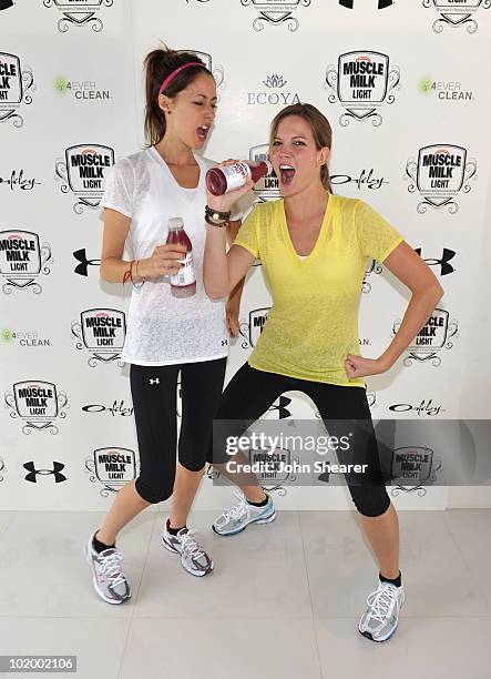 Actresses Amanda Crew and Amber Borycki attend the "Muscle Milk Light" Women's Fitness Retreat on June 11, 2010 in Beverly Hills, California.