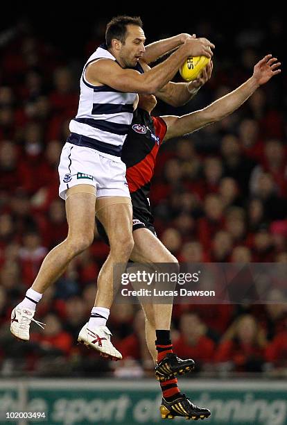 James Podsiadly of the Cats marks the ball during the round 12 AFL match between the Essendon Bombers and the Geelong Cats at Etihad Stadium on June...