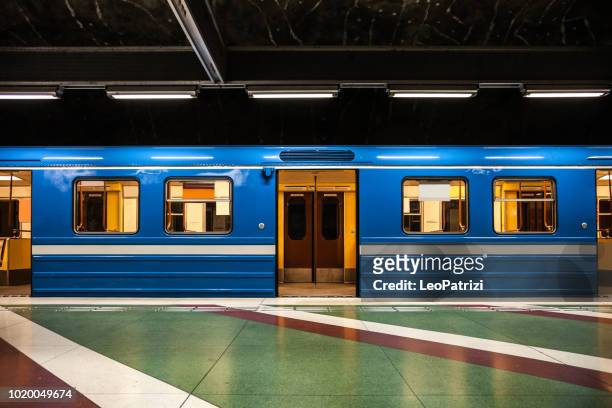subway train departure in stockholm subway platform - subway train stock pictures, royalty-free photos & images