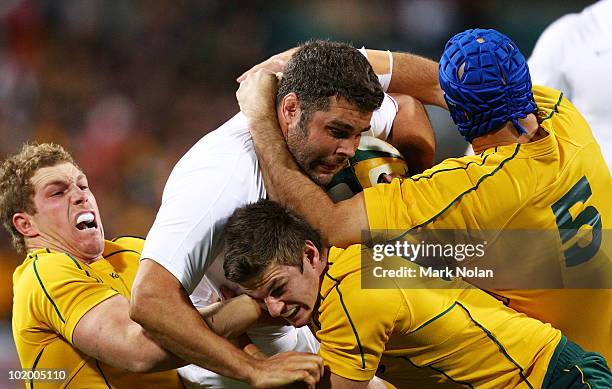 Nick Easter of England is tackled during the Cook Cup Test match between the Australian Wallabies and England at Subiaco Oval on June 12, 2010 in...