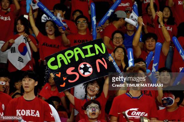 South Korean fans cheer Son Heung Min during the match against Kyrgyzstan in the men's football preliminary group E match of the 2018 Asian Games in...