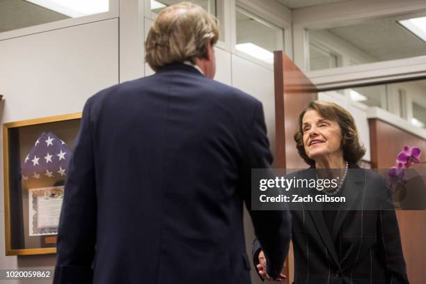 Sen. Dianne Feinstein greets White House Counsel Don McGahn before her meeting with Supreme Court Justice nominee Judge Brett Kavanaugh on Capitol...