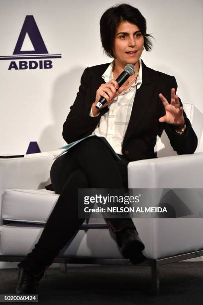 The vice-presidential candidate for the Workers Party Manuela D'Avila, of the Brazil's Communist Party , speaks during an infrastructure forum in Sao...