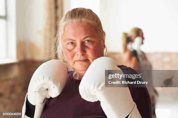 portrait of a female boxer in the gym - female boxing stock pictures, royalty-free photos & images