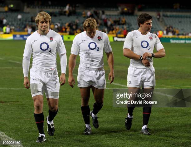 Mathew Tait, Jonny Wilkinson and Ben Youngs look dejected after their teams defeat during the Cook Cup Test match between the Australian Wallabies...
