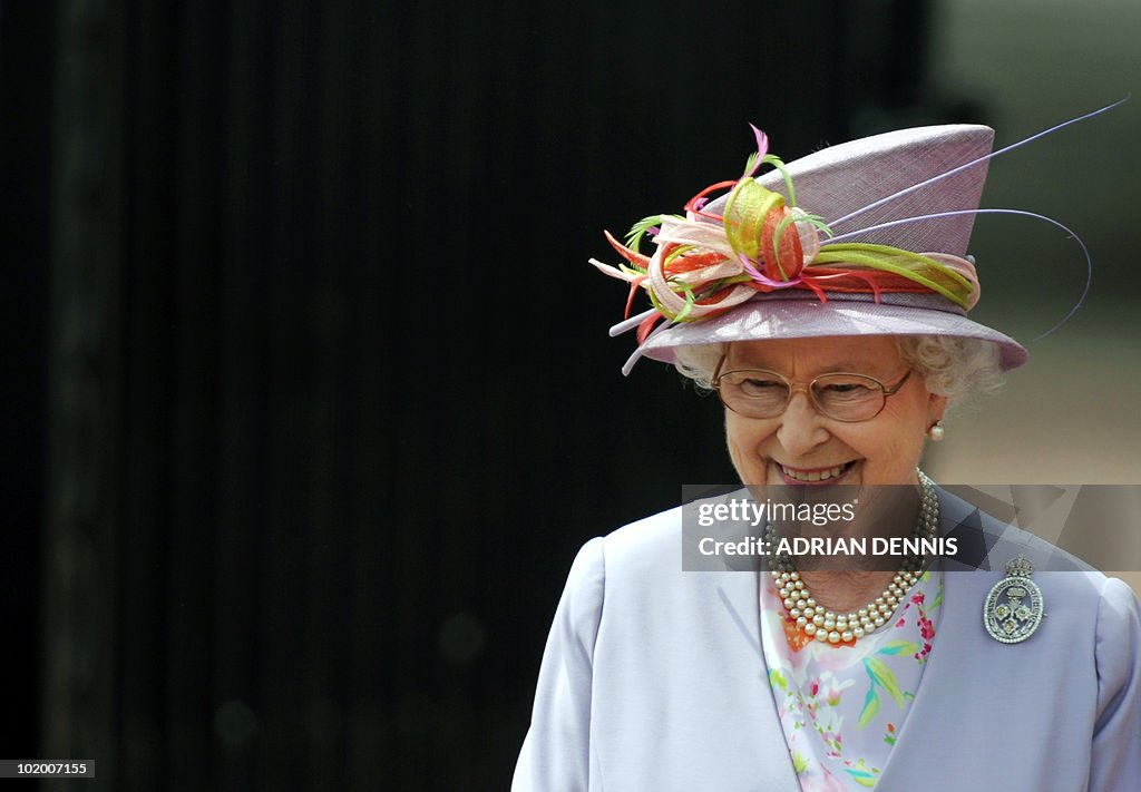 Britain's Queen Elizabeth II looks on as