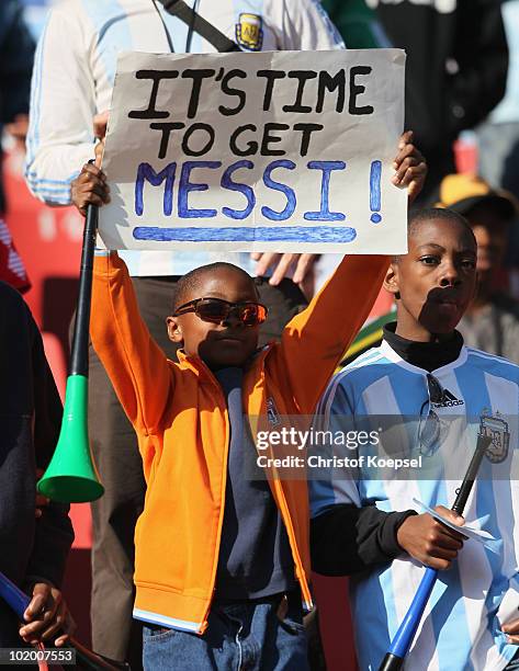 Young Argentina fan holds up a sign for striker Lionel Messi during the 2010 FIFA World Cup South Africa Group B match between Argentina and Nigeria...