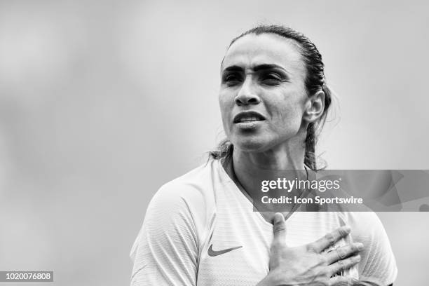 Brazil forward Marta looks on during the national anthem prior to the start of game action during a Tournament of Nations match between Brazil vs...