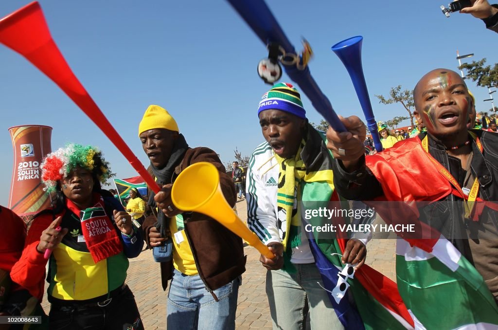 South African supporters sing and dance