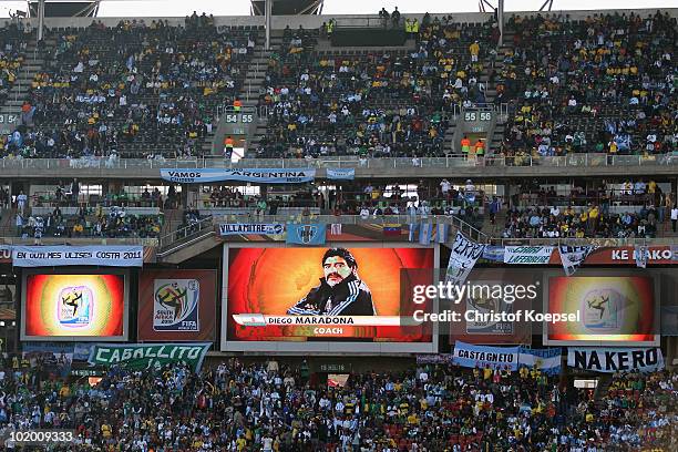 Diego Maradona head coach of Argentina is pictured on a video screen ahead of the 2010 FIFA World Cup South Africa Group B match between Argentina...