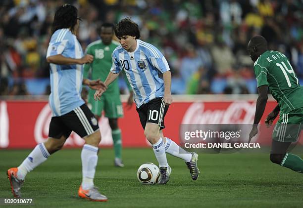 Argentina's striker Lionel Messi vies with Nigeria's midfielder Sani Kaita during their Group B first round 2010 World Cup football match on June 12,...