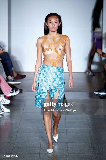 Model walks the runway for Bror at the Bik Bok Runway Award during Oslo Runway SS19 at Bankplassen 4 on August 16, 2018 in Oslo, Norway.