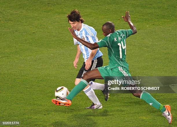 Argentina's striker Lionel Messi vies with Nigeria's midfielder Sani Kaita after Group B first round 2010 World Cup football match on June 12, 2010...