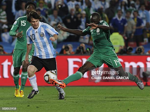 Argentina's striker Lionel Messi vies with Nigeria's midfielder Sani Kaita and Nigeria's midfielder Lukman Haruna during Group B first round 2010...