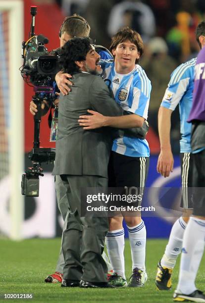 Diego Maradona head coach of Argentina congratulates Lionel Messi after victory in the 2010 FIFA World Cup South Africa Group B match between...