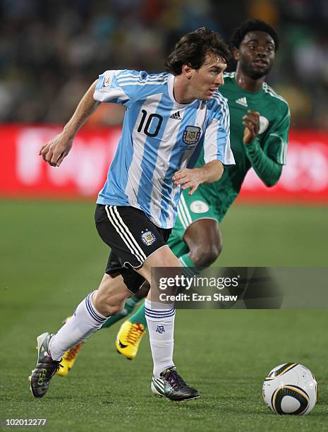 Lionel Messi of Argentina runs with the ball during the 2010 FIFA World Cup South Africa Group B match between Argentina and Nigeria at Ellis Park...