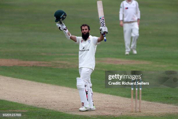 Worcestershire's Moeen Ali raises his bat after reaching his century during day two of the Specsavers Championship Division One match between...