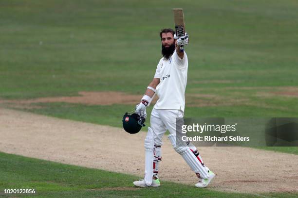 Worcestershire's Moeen Ali raises his bat after reaching his century during day two of the Specsavers Championship Division One match between...