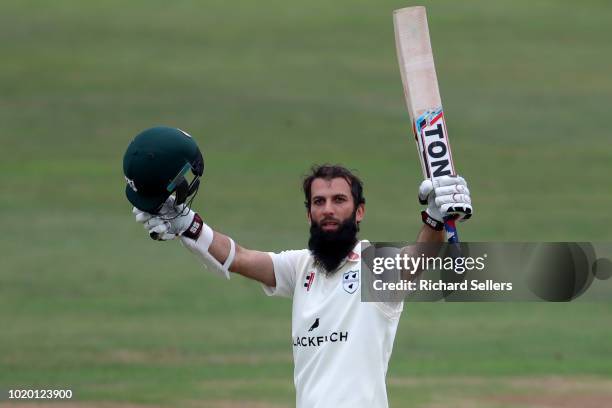 Worcestershire's Moeen Ali raises his bat after reaching his century during day two of the Specsavers Championship Division One match between...