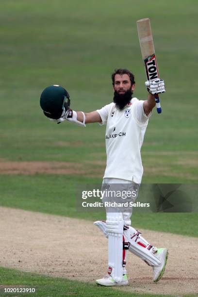 Worcestershire's Moeen Ali raises his bat after reaching his century during day two of the Specsavers Championship Division One match between...