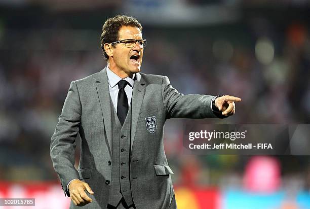 Fabio Capello manager of England gives instructions to his players during the 2010 FIFA World Cup South Africa Group C match between England and USA...