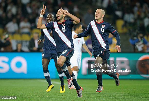 Clint Dempsey of the United States celebrates his goal with team mate Michael Bradley during the 2010 FIFA World Cup South Africa Group C match...