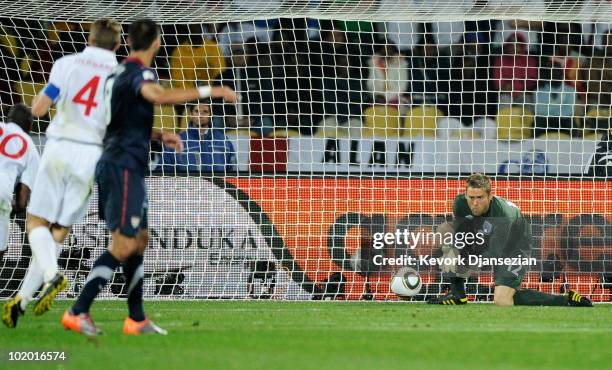Robert Green of England misjudges the ball and lets in a goal during the 2010 FIFA World Cup South Africa Group C match between England and USA at...