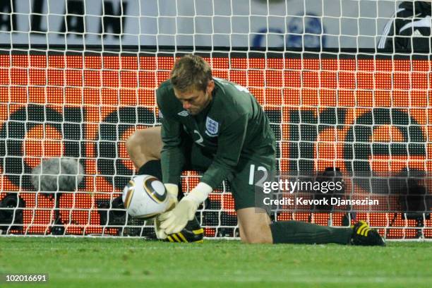 Robert Green of England misjudges the ball and lets in a goal during the 2010 FIFA World Cup South Africa Group C match between England and USA at...