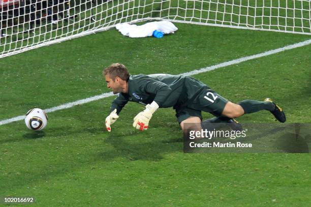 Robert Green of England misjudges the ball and lets in a goal during the 2010 FIFA World Cup South Africa Group C match between England and USA at...
