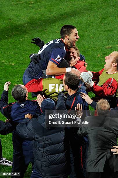 Clint Dempsey of the United States celebrates his goal with teammates during the 2010 FIFA World Cup South Africa Group C match between England and...