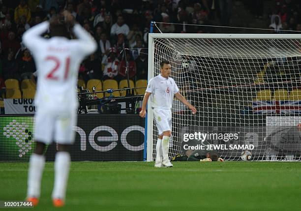 England's goalkeeper Robert Green reacts after US midfielder Clint Dempsey scored against England during the Group C first round 2010 World Cup...