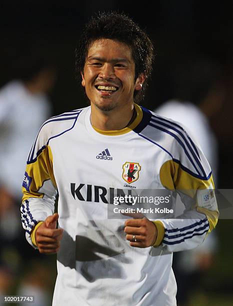 Daiki Iwamasa shares a laugh with a team mate during a Japan training session at the Central University of Technology, Free State ground on June 12,...